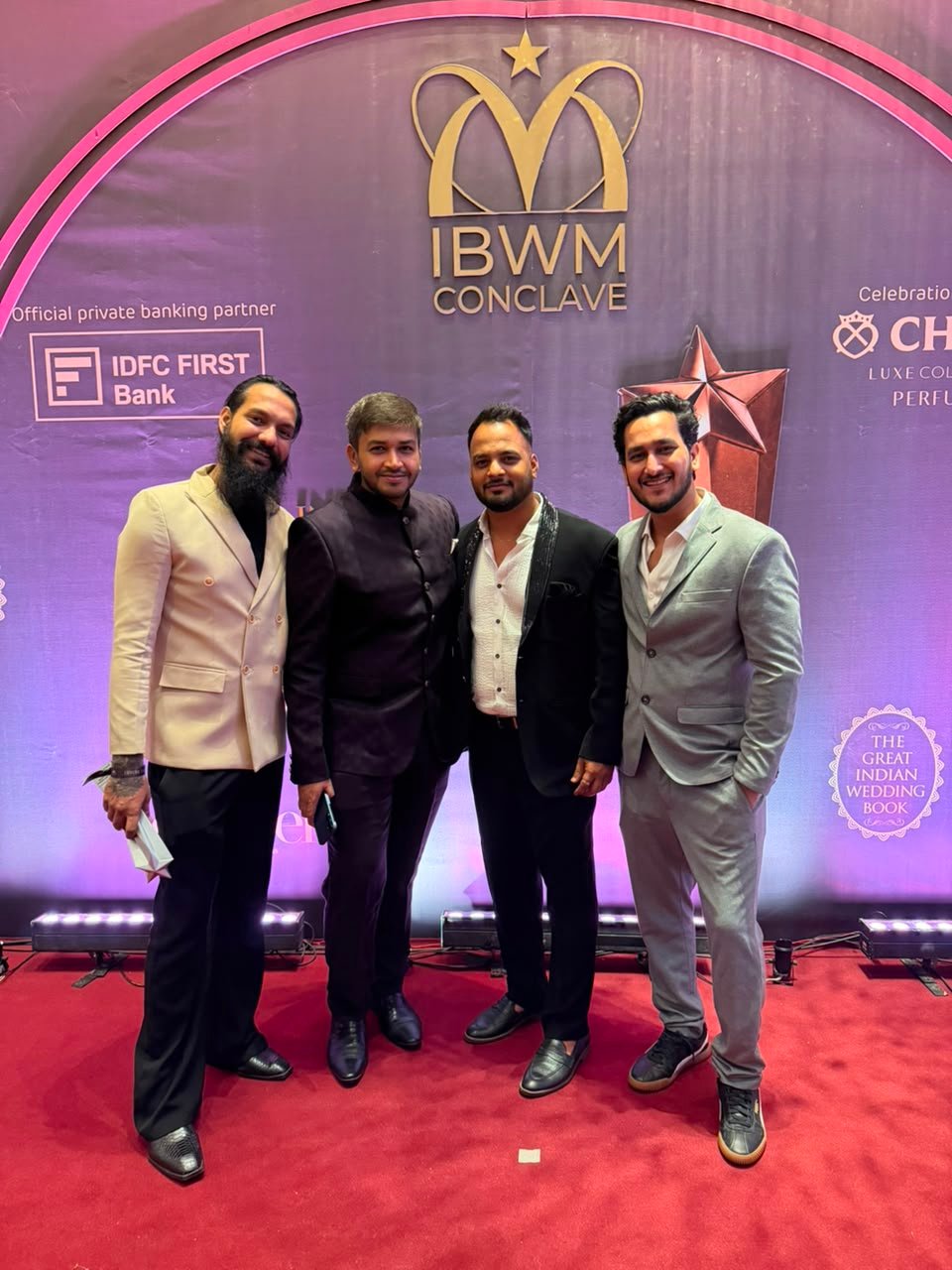 Team members on the red carpet at an industry conclave