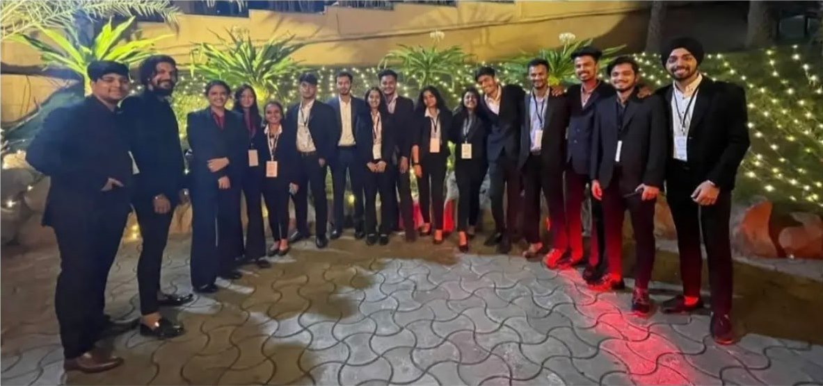 Hospitality team lined up at an outdoor evening reception