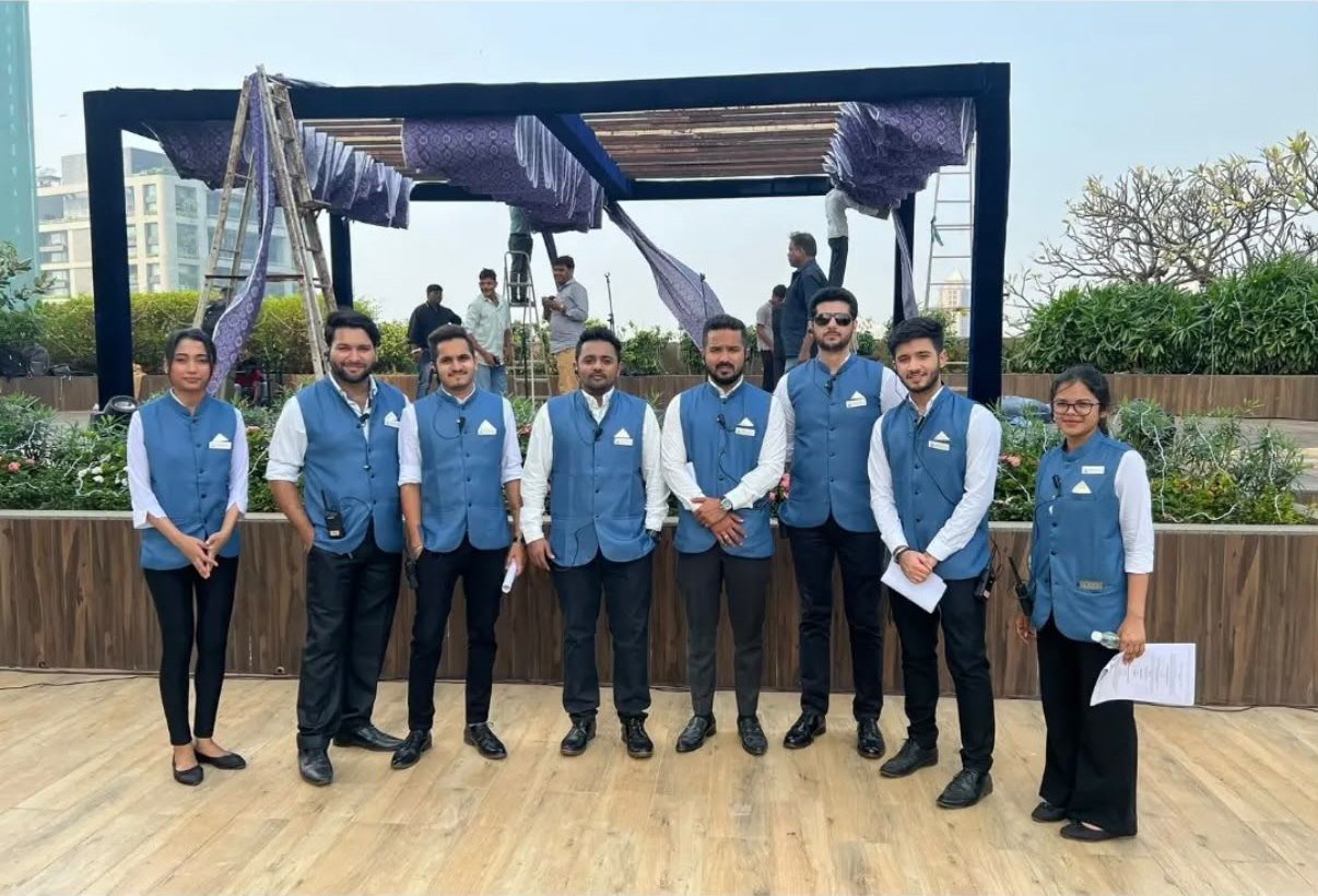 Guest relations team in uniform at a rooftop corporate event